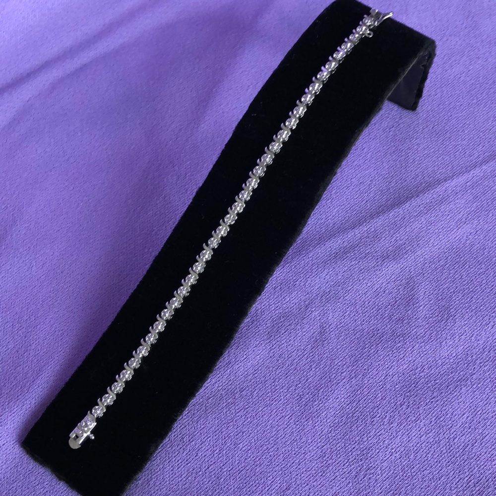 7.5” All sterling silver tennis bracelet.